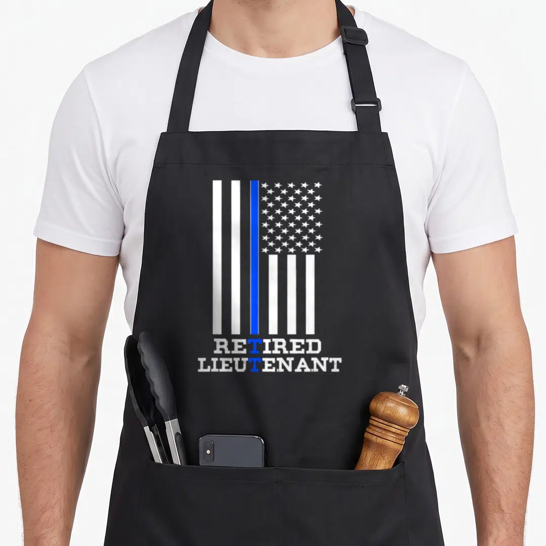 Lieutenant retirement apron - Distressed flag with blue stripe and retired lieutenant text — shown on a black cotton canvas apron against a white background