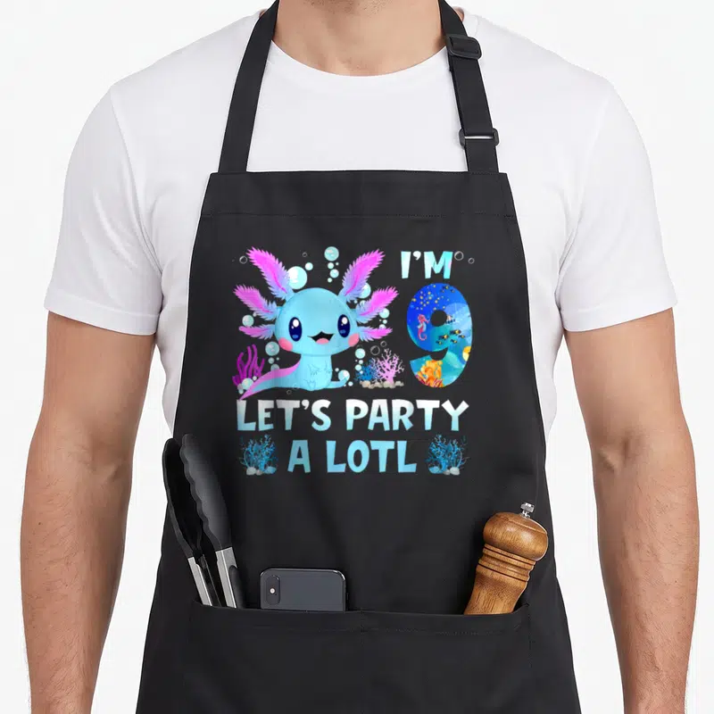 Alotl kawaii apron - Cartoon blue axolotl with pink gills and text I'M 9 LET'S PARTY A LOTL — shown on a black cotton canvas apron against a white background