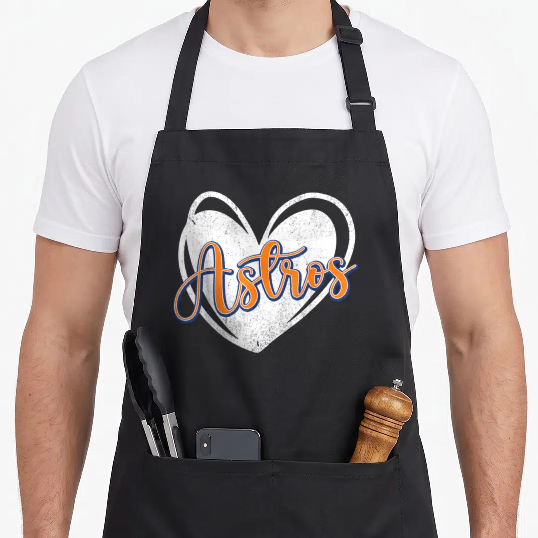 Astro 70s apron - Orange Astros script over distressed white heart with blue outline — shown on a black cotton canvas apron against a white background