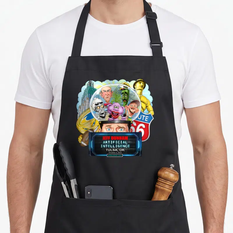 Funny jeff tulsa apron - Jeff Dunham Artificial Intelligence Tulsa 2025 print with five puppets under glass dome — shown on a black cotton canvas apron against a white background