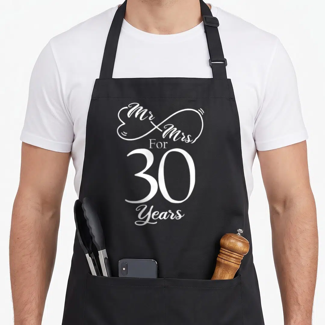 30th mr mrs aprons - White Mr & Mrs For 30 Years text inside infinity heart shape — shown on a black cotton canvas apron against a white background