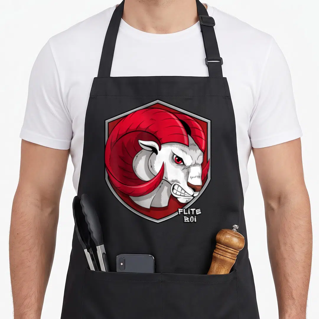 Flite ram apron - Cartoon ram head in red and white hexagon with FLITE BOi text — shown on a black cotton canvas apron against a white background