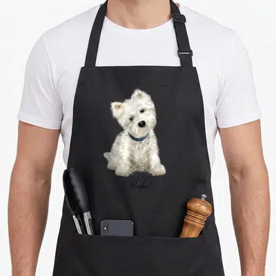 Sweet westie apron - Realistic white dog with blue collar above YOU ARE Pawfect text — shown on a black cotton canvas apron against a white background