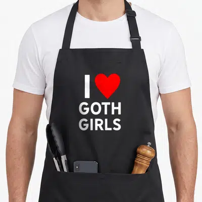 Goth trendy apron - White I and red heart above stacked GOTH GIRLS text on black background — shown on a black cotton canvas apron against a white background