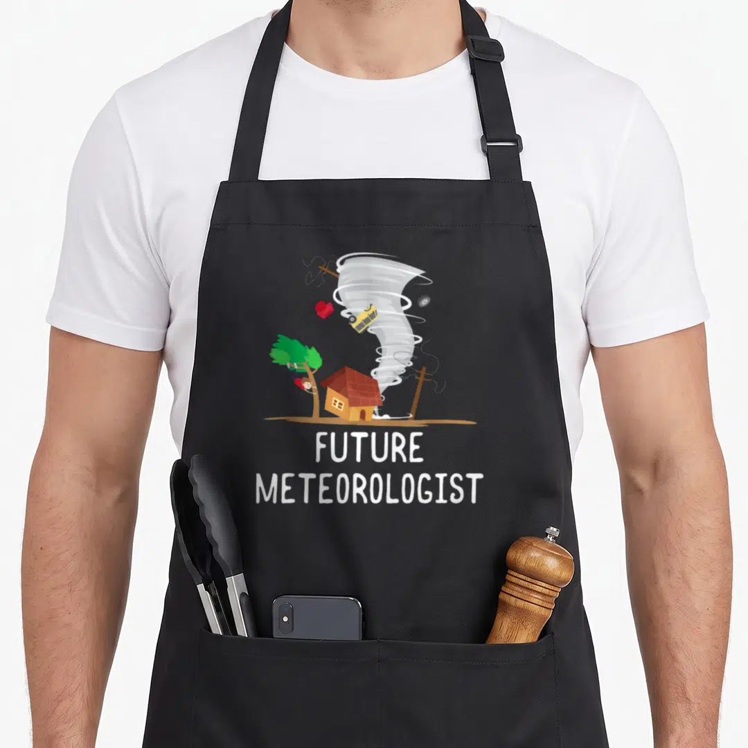 Future i love meteor apron - Cartoon tornado lifting car and heart with person in tree, FUTURE METEOROLOGIST text — shown on a black cotton canvas apron against a white background