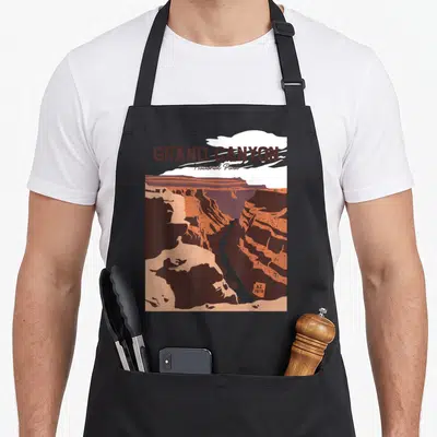 Grand hiking apron - Retro Grand Canyon landscape in brown orange grey and white with 1919 text — shown on a black cotton canvas apron against a white background