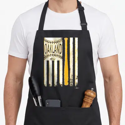 Oakland patriotic apron - Distressed yellow and white stripes with OAKLAND text in stitching and a vertical yellow — shown on a black cotton canvas apron against a white background