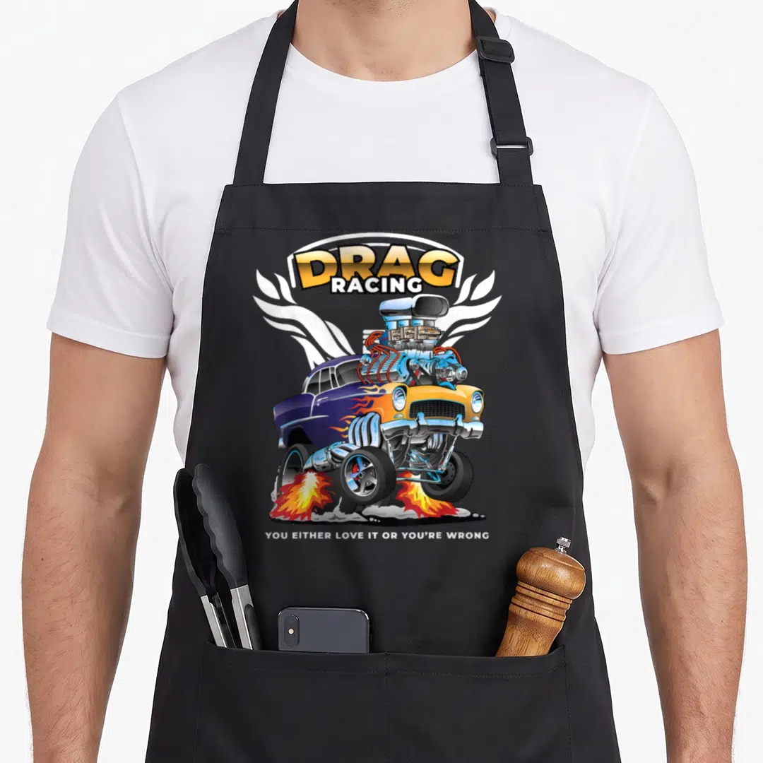 Bracket car apron - Cartoon blue yellow drag racer with flames and DRAG RACING text — shown on a black cotton canvas apron against a white background
