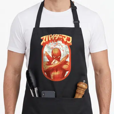 Kanji floral apron - Spider-Man in orange oval with arched Japanese text and pink cherry blossoms — shown on a black cotton canvas apron against a white background