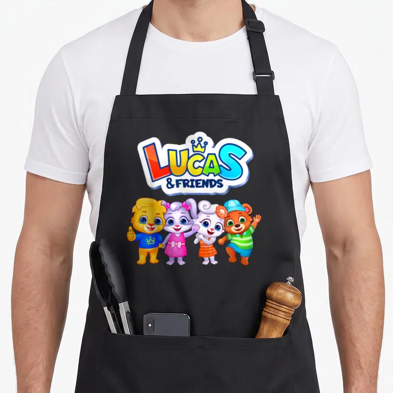 Appstudio friends apron - Four cartoon animals standing below LUCAS & FRIENDS text with a crown icon — shown on a black cotton canvas apron against a white background