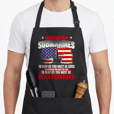 Submarine patriotic apron - Distressed American submarine graphic with patriotic stars and stripes and sarcasm text — shown on a black cotton canvas apron against a white background