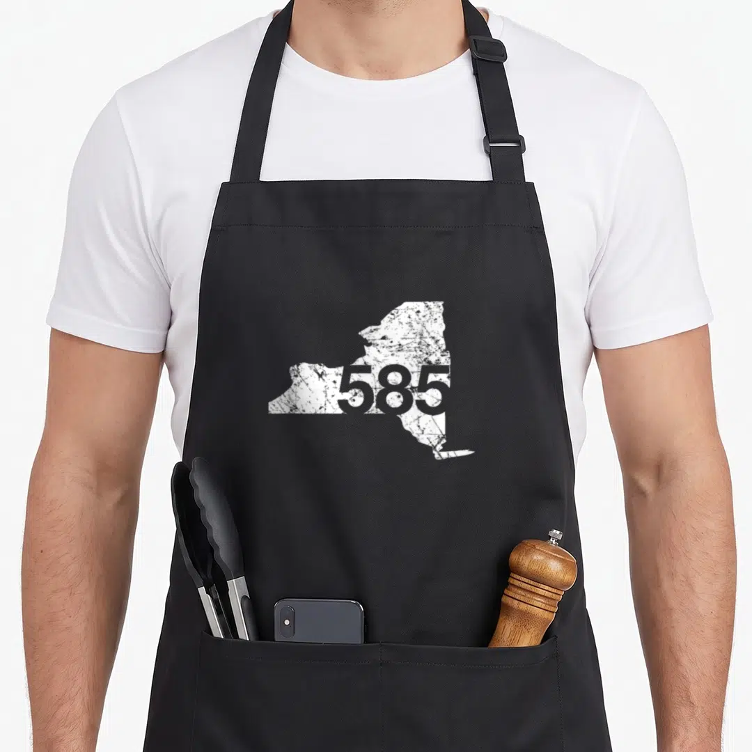 Code new york apron - Distressed white NY state map with grey number 585 overlay — shown on a black cotton canvas apron against a white background