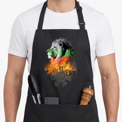 Bulgarian lion apron - Realistic lion head with flag stripes over fire and grey rune symbol — shown on a black cotton canvas apron against a white background
