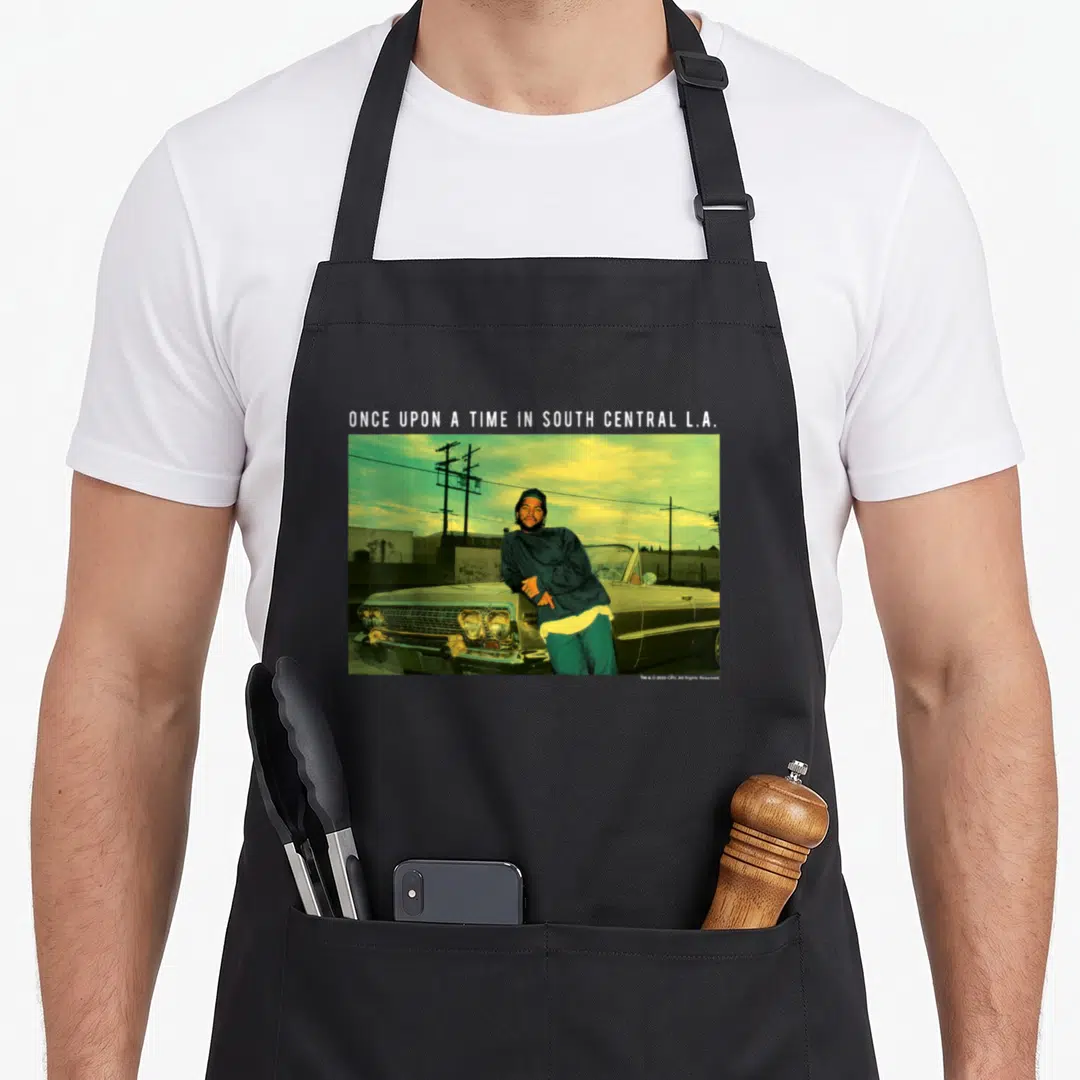 Boyz urban apron - Man leaning on car under Once Upon a Time in South Central L.A. text — shown on a black cotton canvas apron against a white background