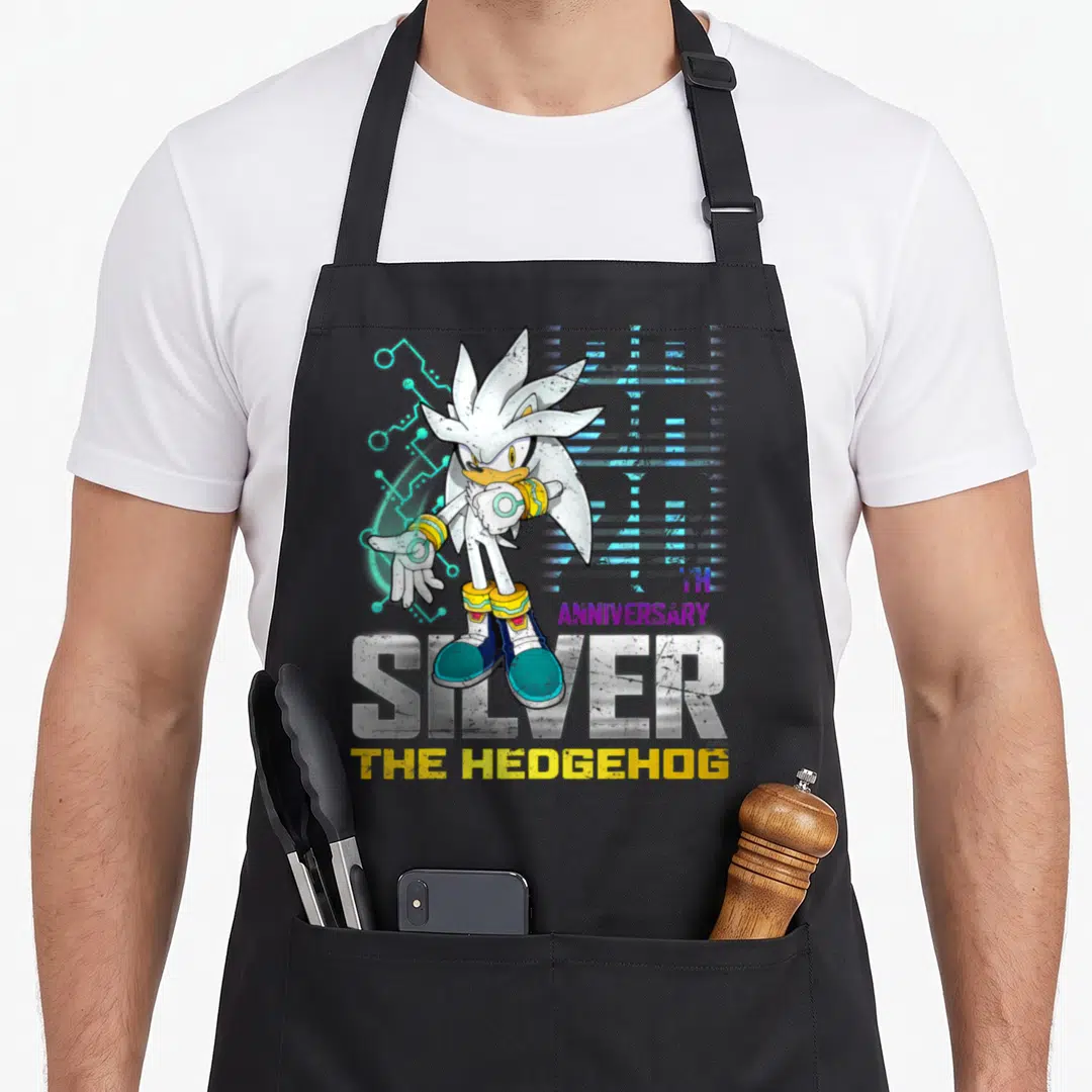 20th distressed apron - Silver the Hedgehog character standing over SILVER text with TH ANNIVERSARY in purple and yellow — shown on a black cotton canvas apron against a white background