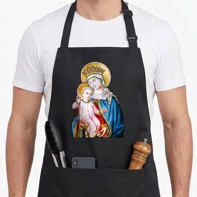 Blessed holding apron - Madonna holding Baby Jesus in blue robe with golden halo and crown — shown on a black cotton canvas apron against a white background