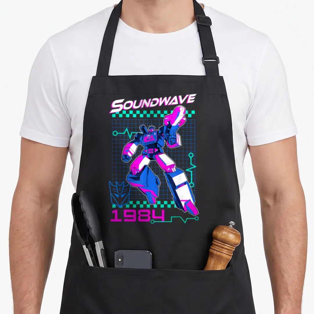 Soundwave transformer apron - Robot over blue grid with teal lines, SOUNDWAVE text, 1984 date, and logo in retro style — shown on a black cotton canvas apron against a white background