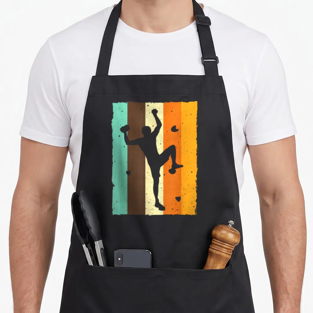 Vintage rock bouldering apron - Grey climber silhouette over five vertical retro stripes in teal brown cream orange — shown on a black cotton canvas apron against a white background