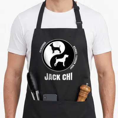 Chihuahua top dog aprons - Yin yang with Chihuahua and Jack Russell Terrier silhouettes and Jack Chi text — shown on a black cotton canvas apron against a white background