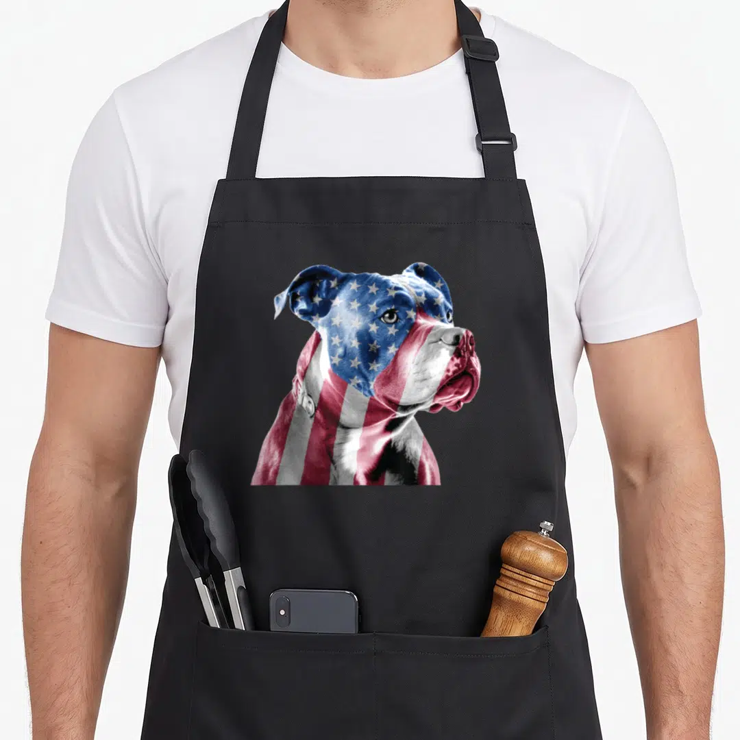 Terrier animal dog apron - Realistic dog head with US flag pattern in red white blue — shown on a black cotton canvas apron against a white background