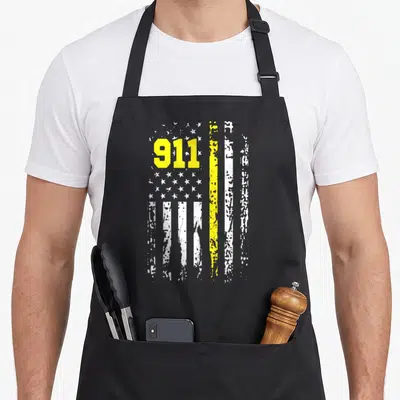 Responder dispatcher apron - 911 text over distressed flag with vertical white and yellow stripes — shown on a black cotton canvas apron against a white background