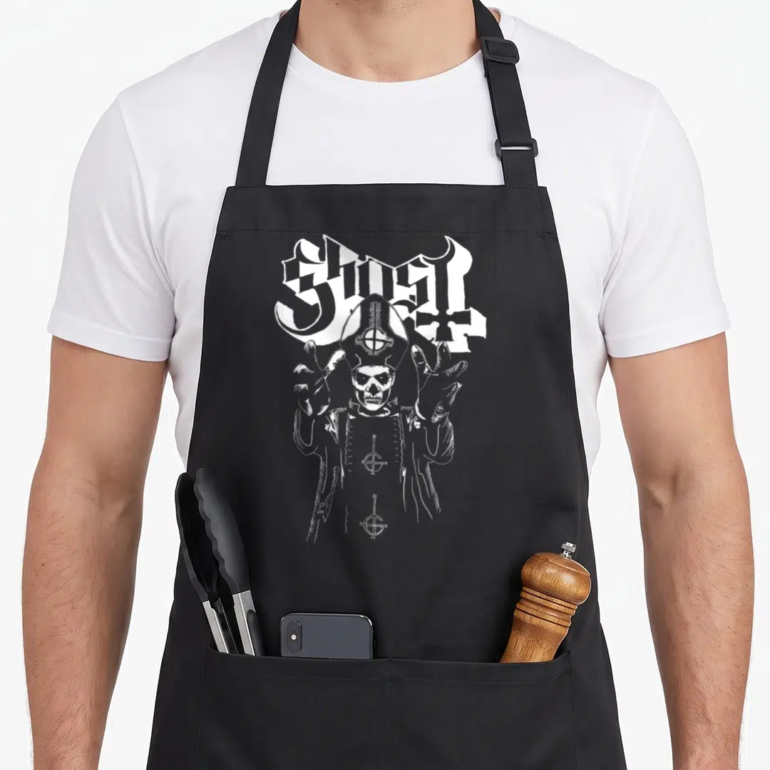 Papas ghost apron - White skeleton in mitre and robes with raised hands and gothic text — shown on a black cotton canvas apron against a white background
