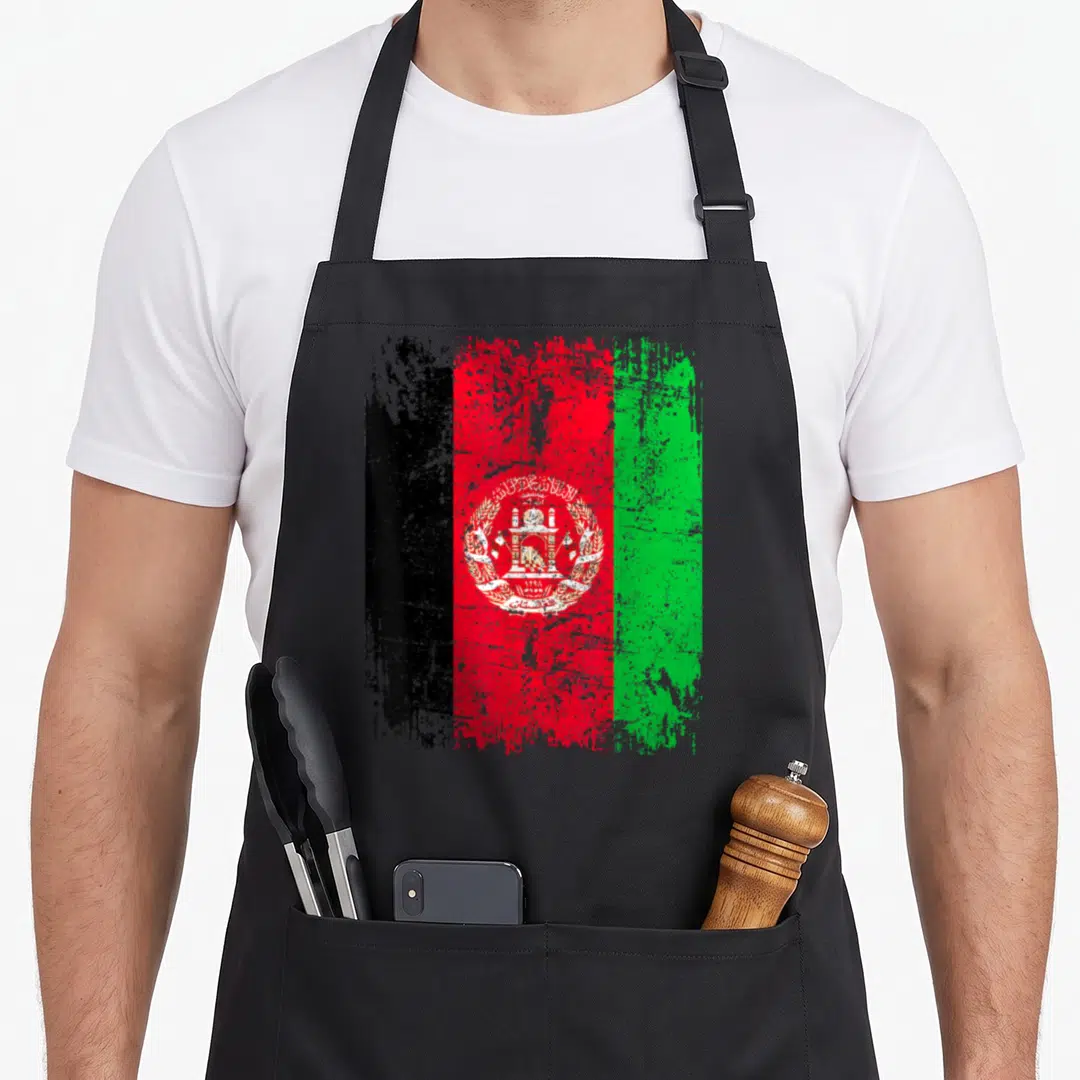 Flag afghan apron - Distressed black red and green flag with white mosque emblem on black bib apron — shown on a black cotton canvas apron against a white background