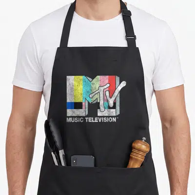 Mtv tv apron - Distressed 3D MTV logo with color bars and white MUSIC TELEVISION text — shown on a black cotton canvas apron against a white background