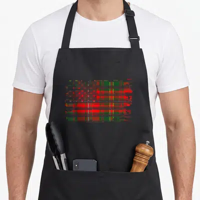 Hay american flag apron - Distressed red green yellow tartan flag with stars and Clan Hay script text — shown on a black cotton canvas apron against a white background