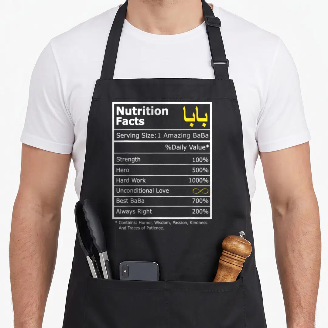 Arabic calligraphy apron - Nutrition facts label with Arabic Baba text, yellow infinity symbol, and white border — shown on a black cotton canvas apron against a white background