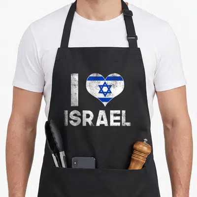 Israel love jewish apron - White I letter next to blue and white heart with Star of David and ISRAEL text below — shown on a black cotton canvas apron against a white background