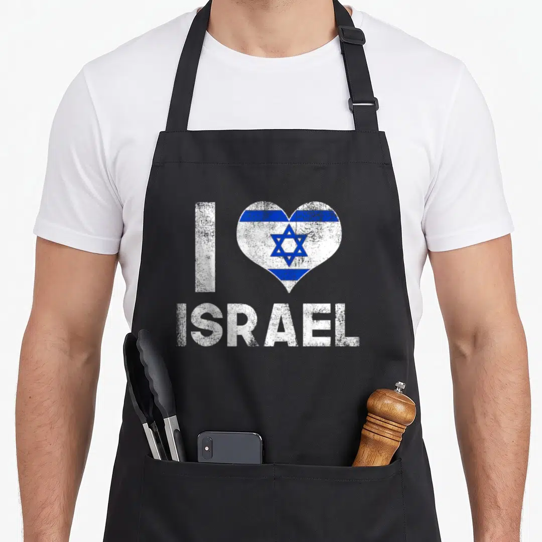 Israel love jewish apron - White I letter next to blue and white heart with Star of David and ISRAEL text below — shown on a black cotton canvas apron against a white background