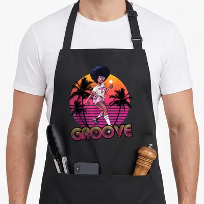 Afro 70s apron - Woman on roller skates with 78 GROOVE text and gradient sun — shown on a black cotton canvas apron against a white background