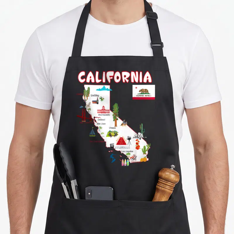 Map major apron - California map with city names, landmarks, and state flag in cartoon style — shown on a black cotton canvas apron against a white background