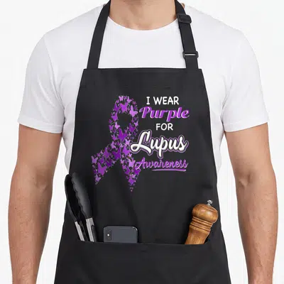 Lupus i love star apron - Purple butterfly awareness ribbon with stacked I WEAR Purple FOR Lupus Awareness text — shown on a black cotton canvas apron against a white background