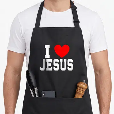 Faith i love goer apron - White I JESUS text with red heart symbol on grey background — shown on a black cotton canvas apron against a white background