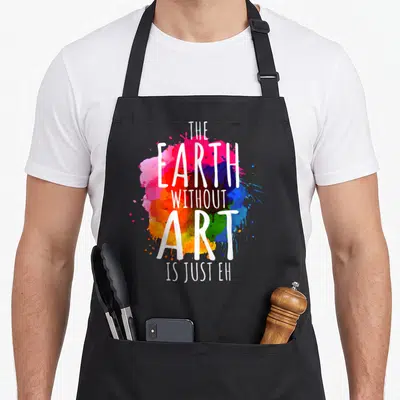 Earth teacher apron - White text reading The Earth Without Art Is Just Eh over pink red blue yellow green watercolor — shown on a black cotton canvas apron against a white background