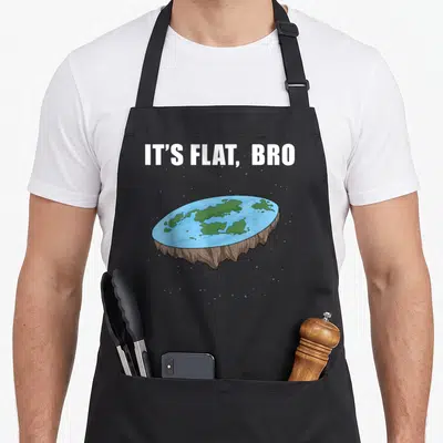 Ice flat apron - Cartoon flat earth disc with IT'S FLAT, BRO text and scattered blue stars — shown on a black cotton canvas apron against a white background