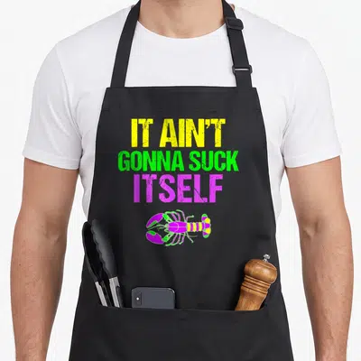 Suck mardi gras aprons - Stacked yellow green purple text IT AIN'T GONNA SUCK ITSELF above colored lobster — shown on a black cotton canvas apron against a white background
