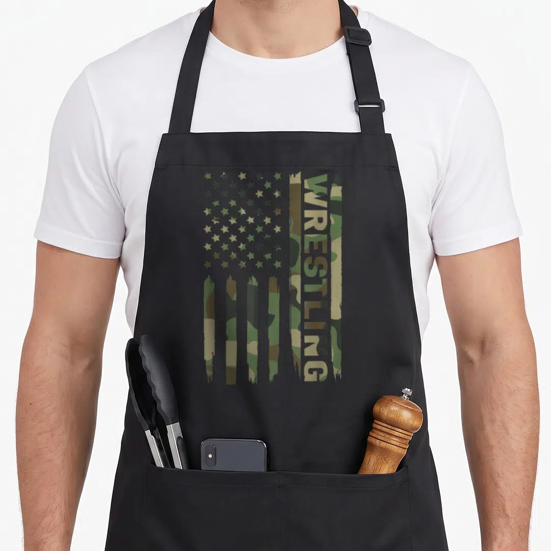 Wrestling camo aprons - Distressed flag with vertical WRESTLING text in olive green tan and brown stripes — shown on a black cotton canvas apron against a white background