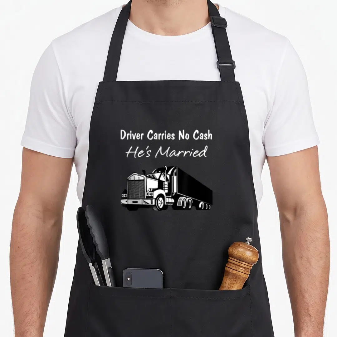 Driver cash and carry aprons - White text Driver Carries No Cash He's Married above a black semi-truck graphic — shown on a black cotton canvas apron against a white background