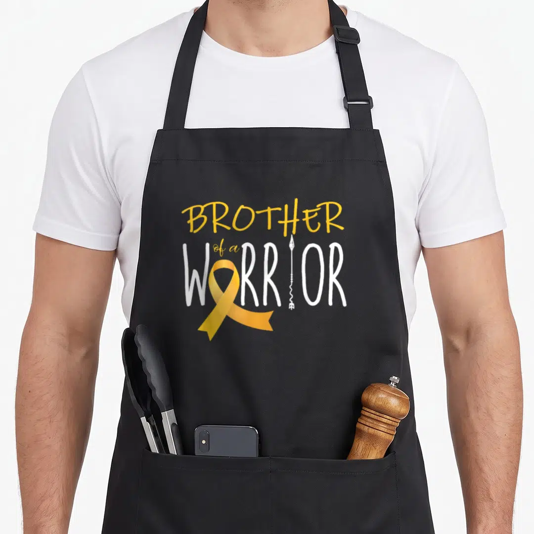 Brother cancer girl apron - Yellow ribbon and white arrow replacing letters in Brother of a Warrior text — shown on a black cotton canvas apron against a white background