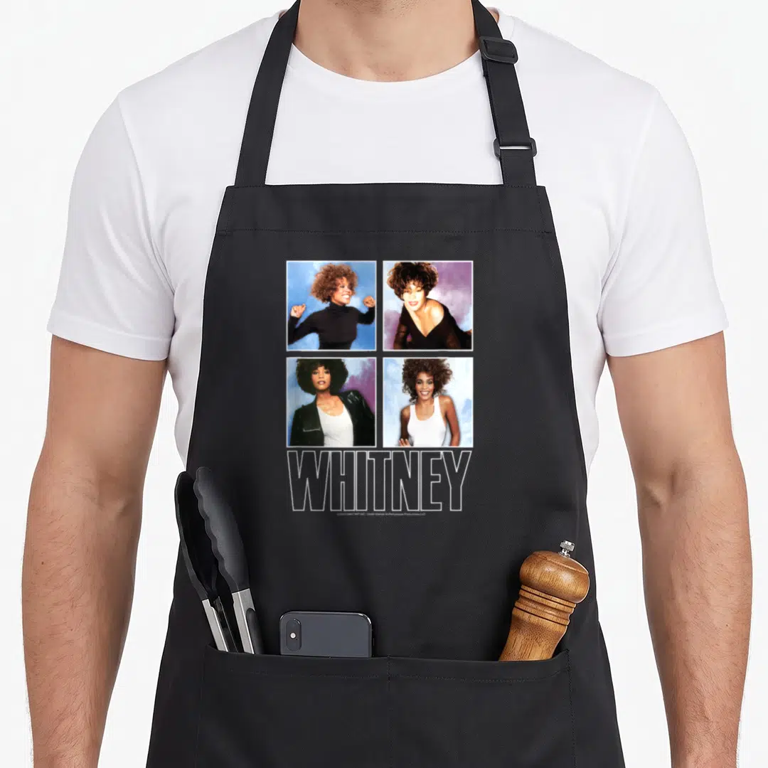 Whitney houston problem apron - Four square photos of Whitney Houston in a grid above large outlined WHITNEY text — shown on a black cotton canvas apron against a white background