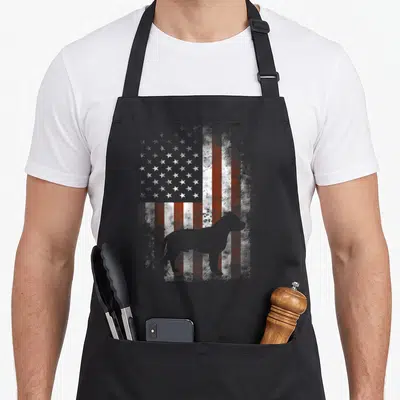 Terrier american flag apron - White dog silhouette on distressed red and white flag pattern — shown on a black cotton canvas apron against a white background