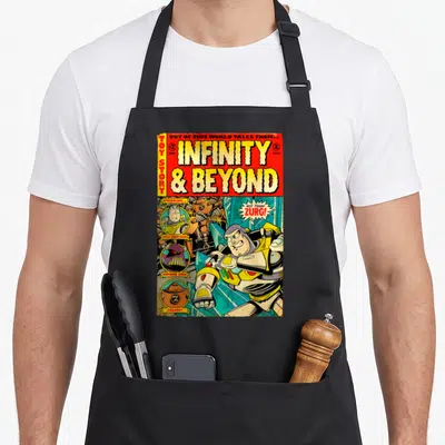 Comic camping apron - Retro comic book cover with Buzz Lightyear fighting Zurg and large yellow title text — shown on a black cotton canvas apron against a white background