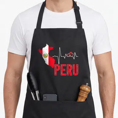 Peru flag pride apron - Map of Peru in red and white with heartbeat line and two red hearts — shown on a black cotton canvas apron against a white background