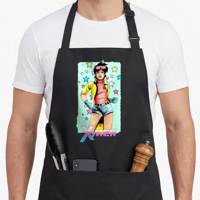 Jubilee x apron - Cartoon woman in yellow jacket and pink top surrounded by stars with X-MEN text below — shown on a black cotton canvas apron against a white background