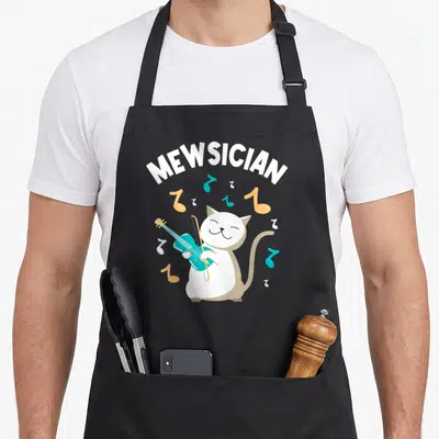 Mewsician cat apron - Cartoon white cat playing teal violin with MEWSICIAN text and scattered notes — shown on a black cotton canvas apron against a white background