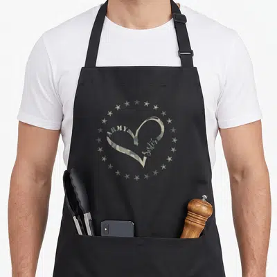 Proud army sister camouflage apron - Camo heart with ARMY and sister text surrounded by 16 stars in olive green tan — shown on a black cotton canvas apron against a white background