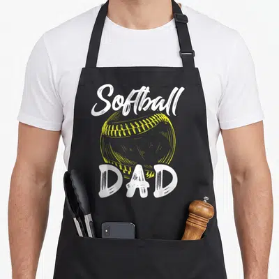Softball family father day apron - White Softball and DAD text surrounding a yellow stitched softball illustration — shown on a black cotton canvas apron against a white background